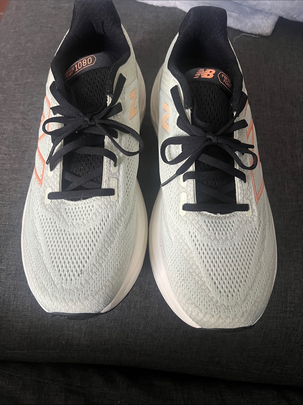 New Balance Men's Pale Gray Athletic Sneakers with Black and Peach Accents
